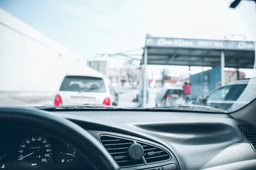 Fototapeta premium car line in car wash. time to clean auto. view from inside
