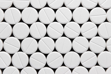 texture, background, of white pills on a black background