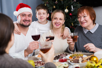 Family at dining table for Christmas dinner