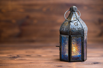 Arab lamp on wooden background, concept Ramadan Kareem