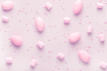 sugared almonds candies, marshmallows and sprinkles,  soft pink background