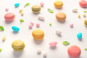 Fototapeta na wymiar macarons cookies and candies on light background, dessert concept
