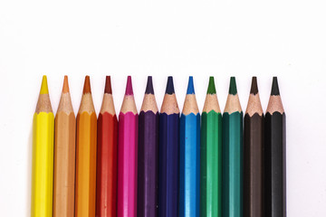 row of colored wooden pencils,forming a line
