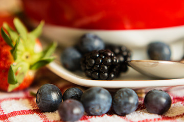 Macro view of blackberries, blueberries, strawberries and muesli