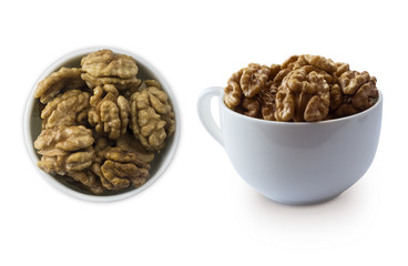 Kernels walnuts isolated on white. Walnuts in a bowl isolated on white background. Walnuts with copy space for text on a white background