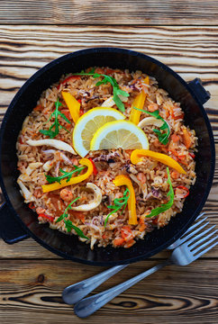 Seafood paella in a frying pan