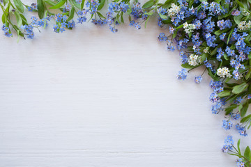Forget-me-nots on a wooden background