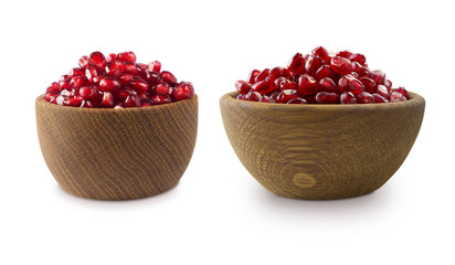 two bowls with pomegranate seeds isolated on white background. Ripe pomegranates close-up. Sweet and juicy garnet with copy space for text.