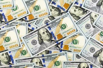 Pile of new design US dollar bills as background. Top view point.
