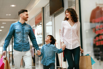 Family Shopping. Happy People In Mall