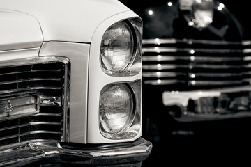 Luxury vintage car headlight closeup.