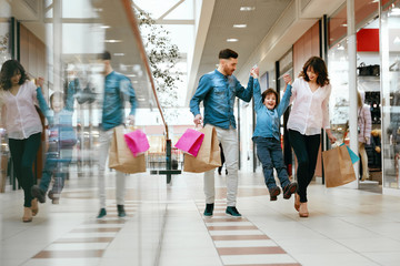 Family Shopping. Happy People In Mall