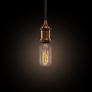 Vintage light bulb on dark background.
