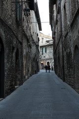 Fototapeta na wymiar Assisi, among the walls