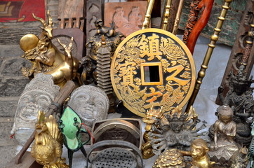 PINGYAO, CHINA - May 7, 2017 - Old metal souvenirs and decoration from China on market in Pingyao