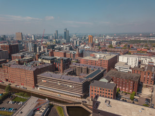 Obraz premium Manchester City Centre Skyline British Aerial Drone Above View Blue Sky Summer Cityscape 