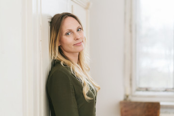 Thoughtful serene young blond woman