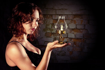young girl holding a retro lantern