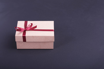 Gift boxes with bow on wood background