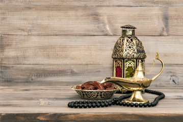 Oriental lamp dates lantern rosary still life