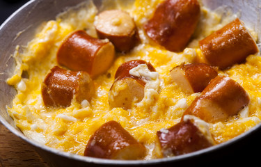 Breakfast of scrambled eggs with and sausages