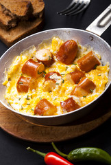 Breakfast of scrambled eggs with and sausages