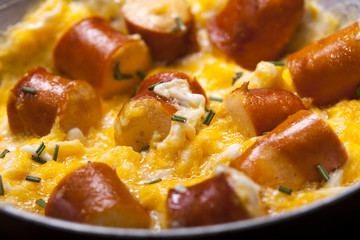 Breakfast of scrambled eggs with and sausages