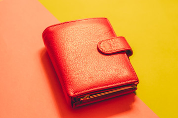 Red leather wallet on a watermelon and green backround