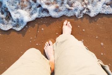 feet walking on the beach