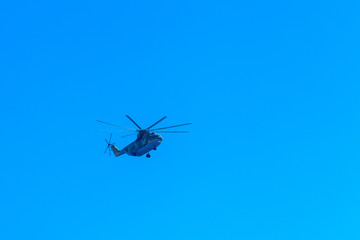 Fototapeta na wymiar helicopters in the blue sky flying parade
