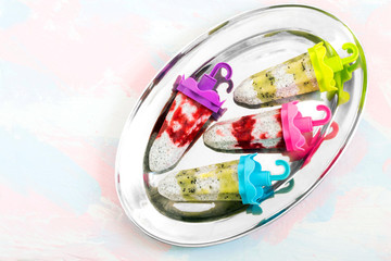 Ice cream with coconut milk, chia seeds, kiwi and strawberries