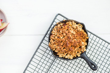 Homemade cooked rhubarb and apple crumble with oatmeal