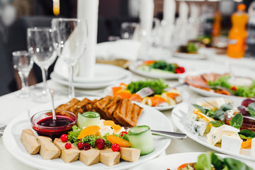 Beautifully decorated catering banquet table with different food