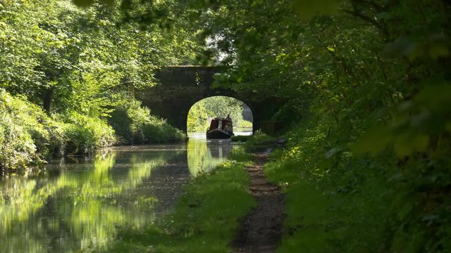 narrow boats navigating canal - Shropshire Union Canal, Bridge 32, Cowley near Stafford, England