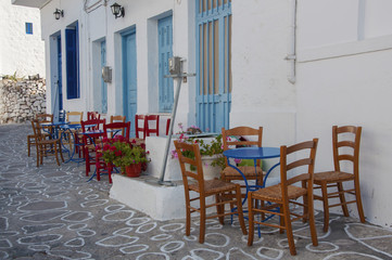 Outdoor part of a taverna on the street of Kimolos island in Greece