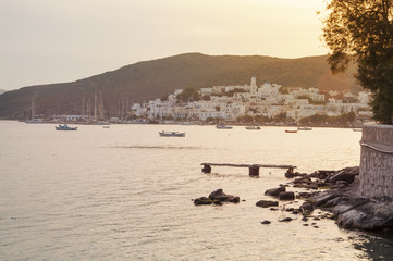 Panoramic view of Adamas town at Milos island in Greece at sunset time