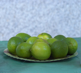 Limes on a plate, still life of limes with background for your photographs