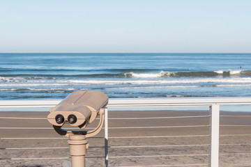 Sightseeing binoculars overlooking the ocean on Fletcher Cove Beach Park in the city of Solana...