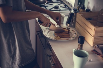 Woman cooking breakfast in the morning