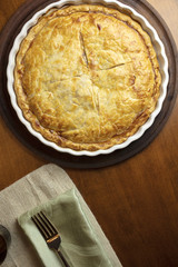 Golden crust Ham and Cheese Tart just baked and sitting on the counter ready to serve