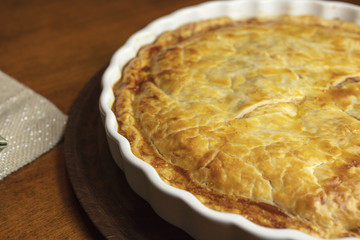 Golden crust Ham and Cheese Tart just baked and sitting on the counter ready to serve