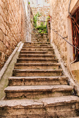 Fototapeta na wymiar Stone Steps up Kotor Alley