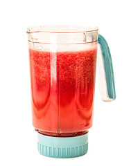 watermelon and mineral water in a blender. making a smoothie in a blender. blender with watermelon isolated on white background