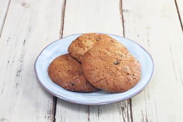 Handmade chocolate cookies on wooden table