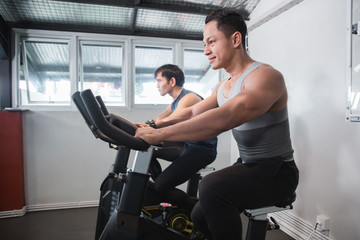 Asian muscular male doing cardio excercises