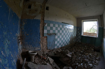 Totally marauded and vandalised residential building. 3 km. near Chernobyl area border. Kiev region. Ukraine
