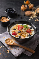 Concept of healthy food and lifestyle, Breakfast meal, Natural yogurt with fresh berries and cereal.