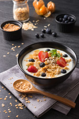 Concept of healthy food and lifestyle, Breakfast meal, Natural yogurt with fresh berries and cereal.