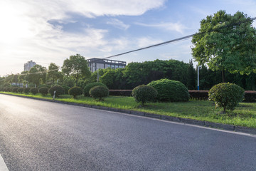 emtpty road with modern office building
