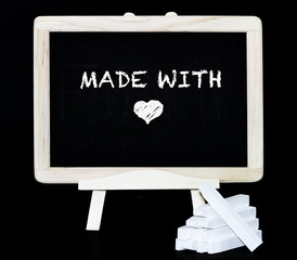 Made with love symbol on blackboard